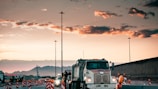 Concrete truck navigating through a busy urban construction zone.