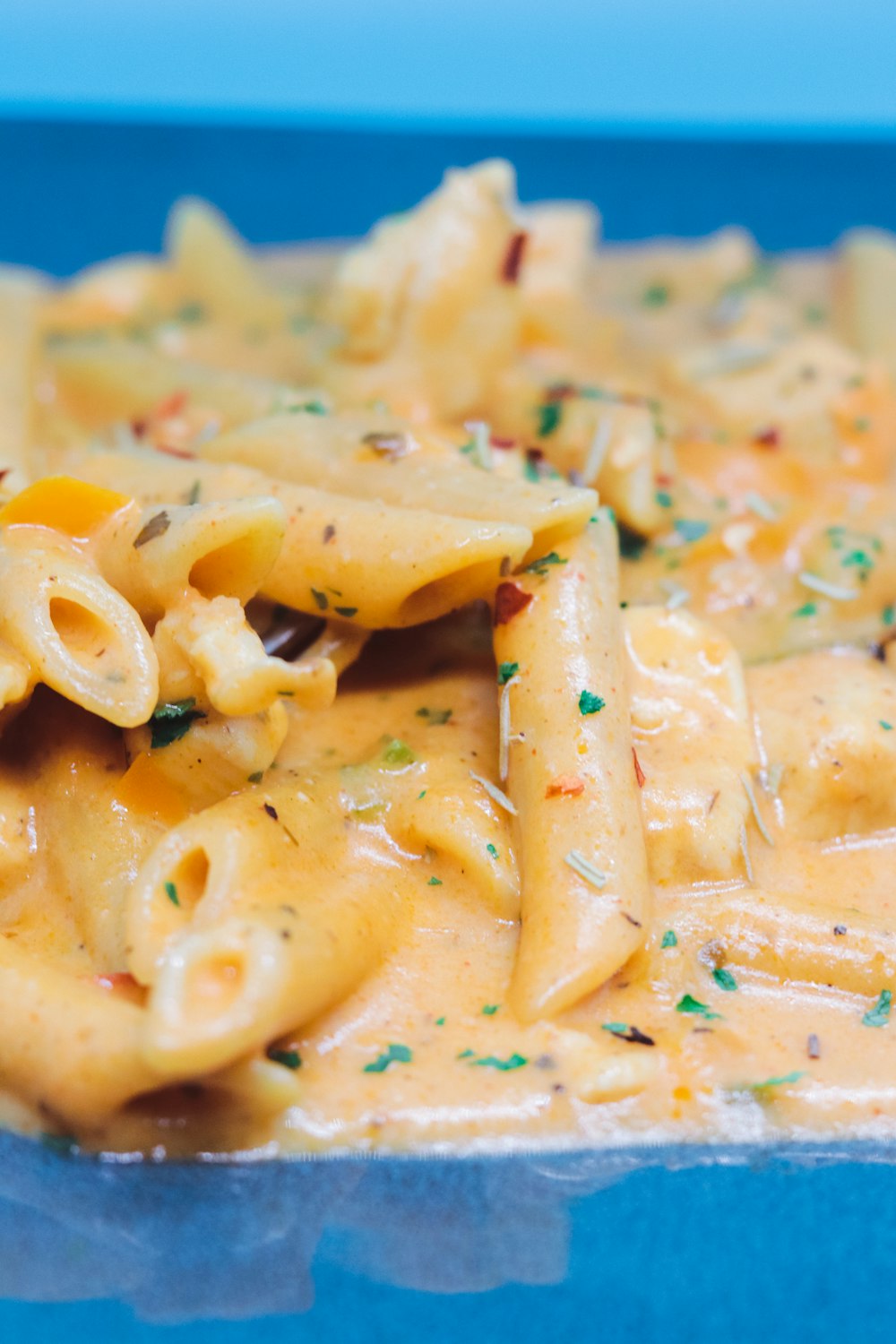 pasta dish on blue ceramic plate