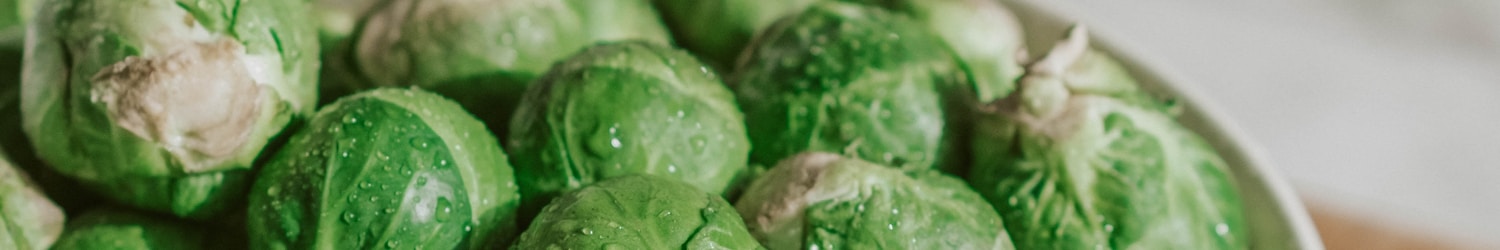 green vegetable on white ceramic bowl