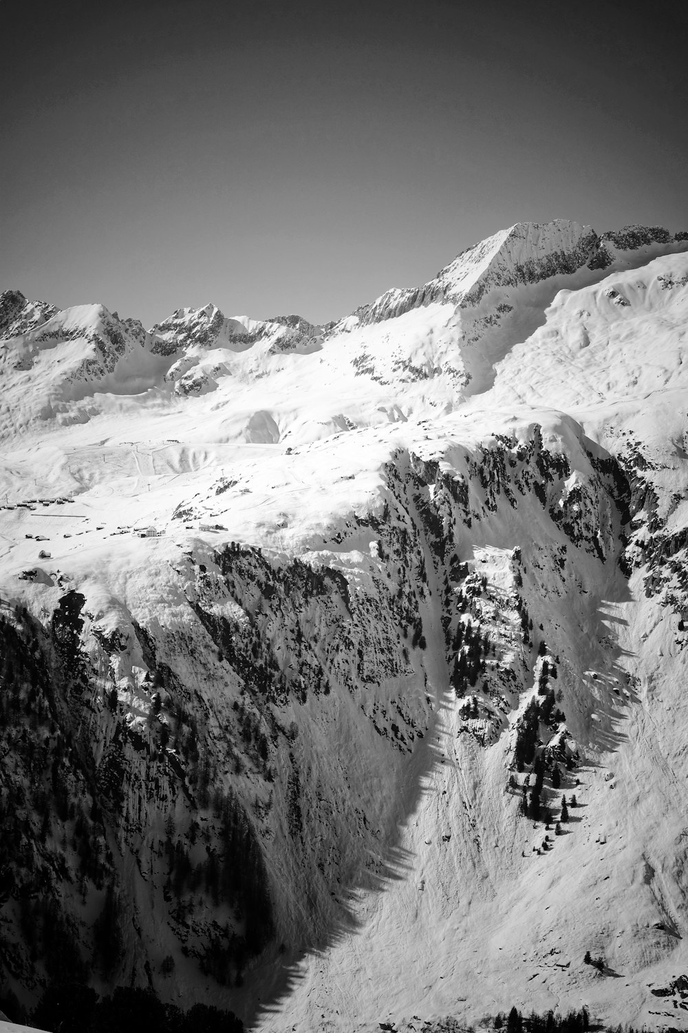 grayscale photo of snow covered mountain