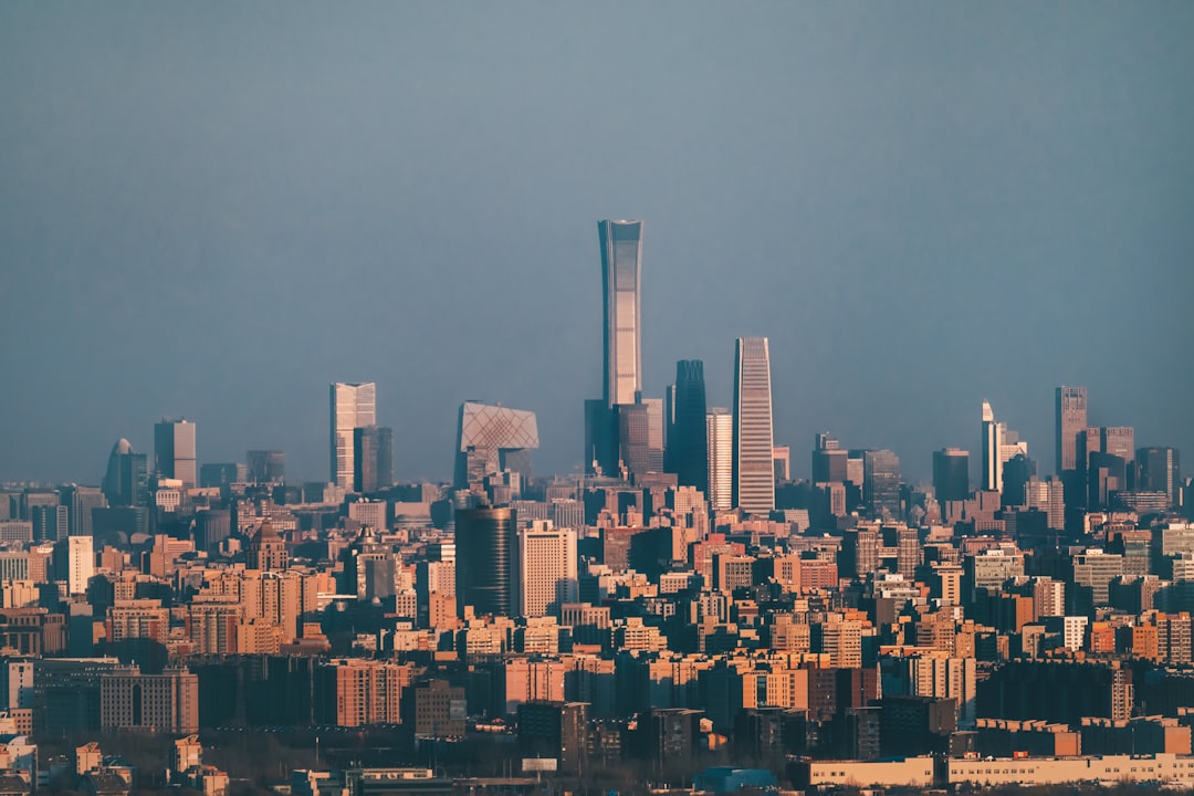 city skyline under gray sky during daytime