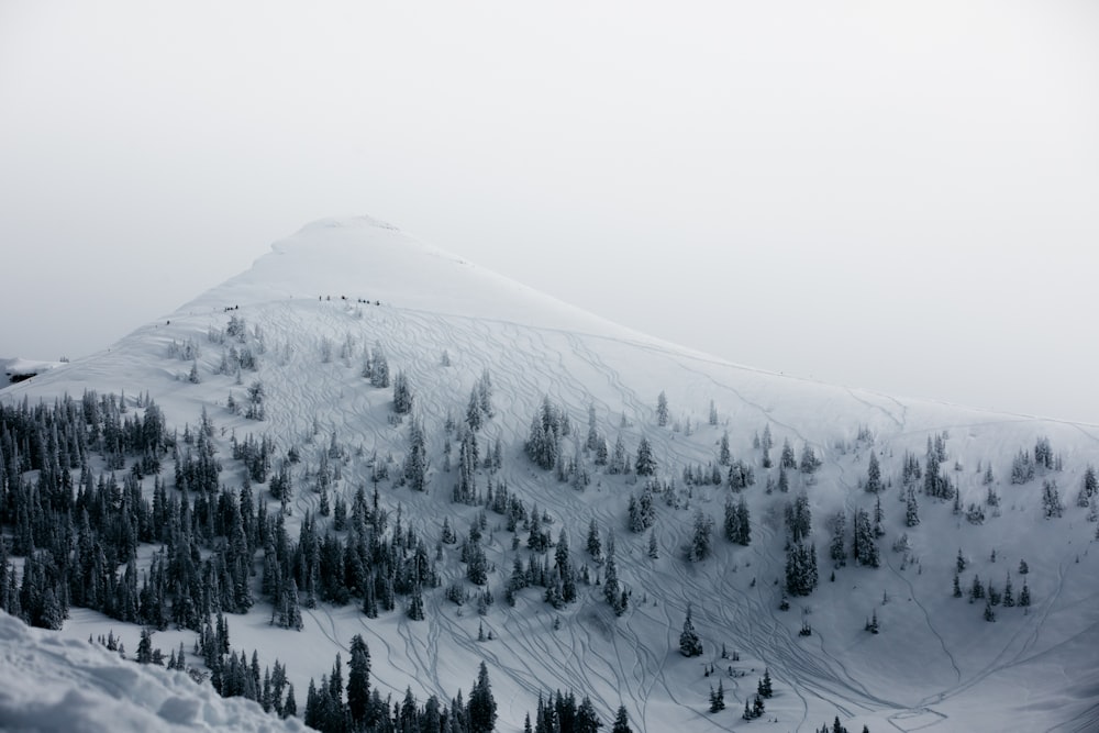 snow covered mountain during daytime