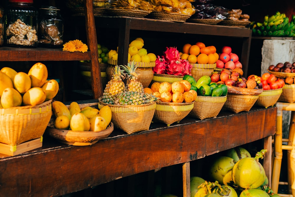 assorted fruits on brown wooden crate