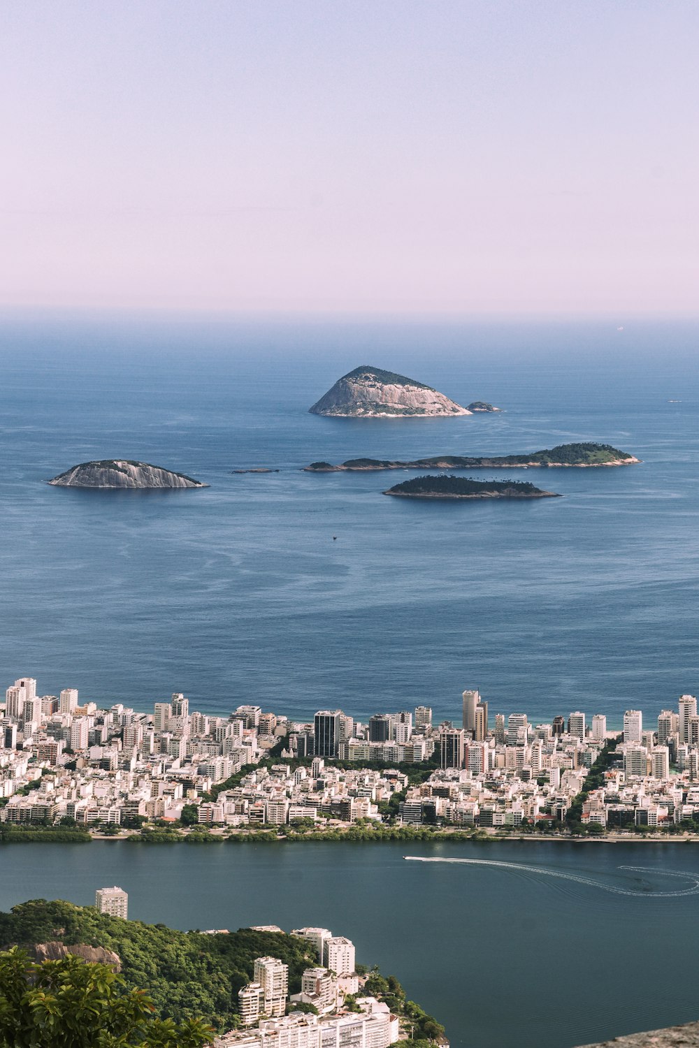 city skyline across blue sea during daytime