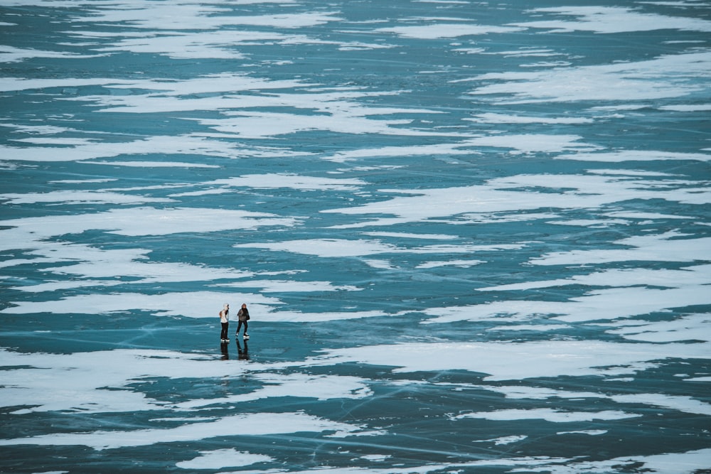 2 person in water during daytime