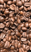 brown coffee beans on black surface