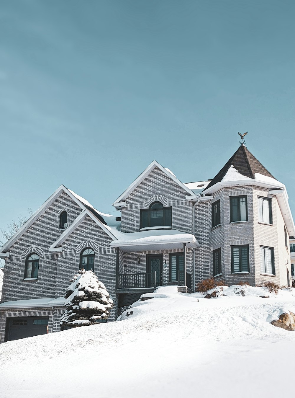 brown and white concrete house under blue sky during daytime