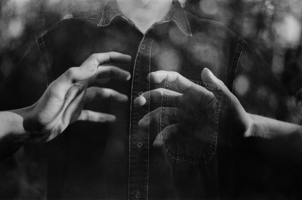 grayscale photo of person wearing button up shirt