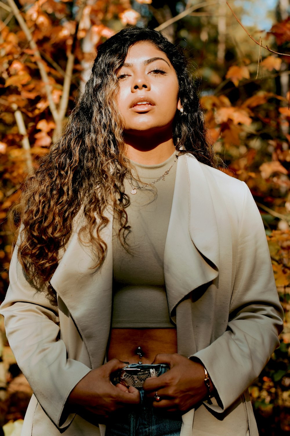 woman in white long sleeve shirt and brown vest