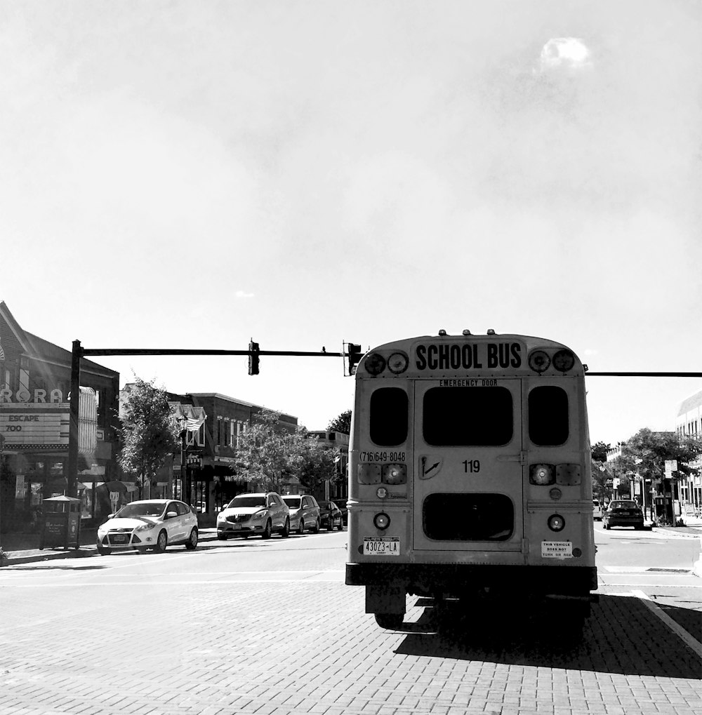 yellow school bus on road during daytime