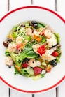 vegetable salad on white ceramic bowl