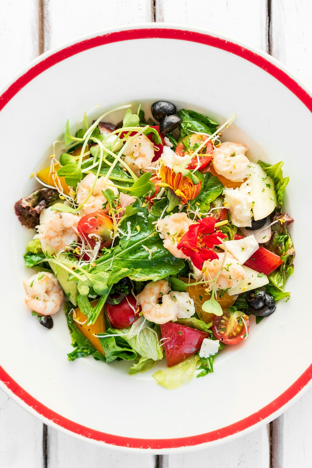 vegetable salad on white ceramic bowl