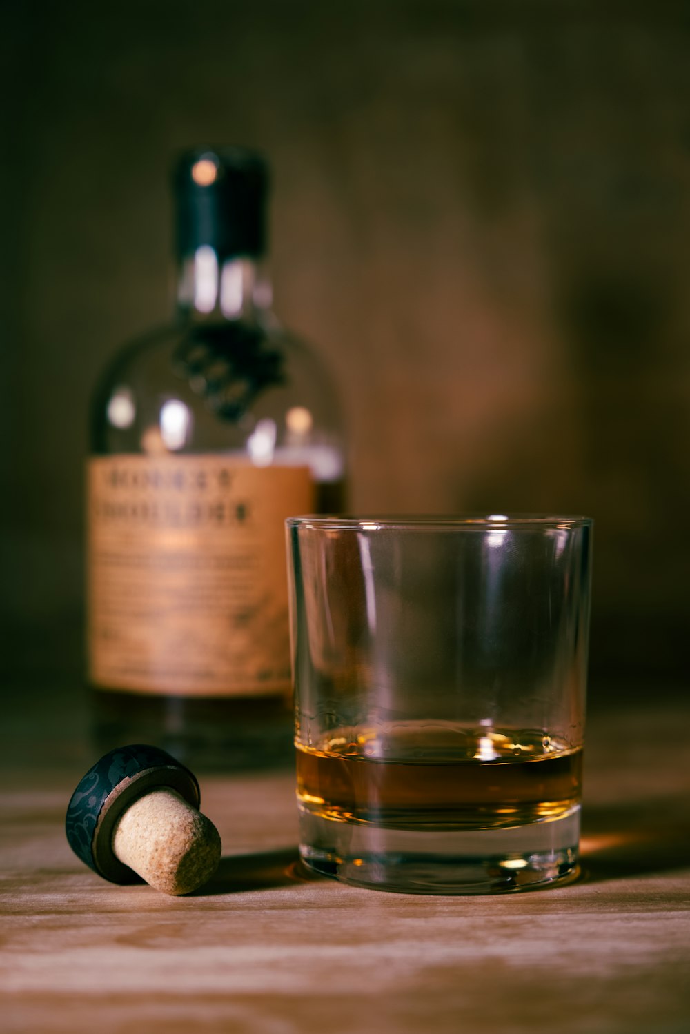 clear drinking glass with brown liquid inside