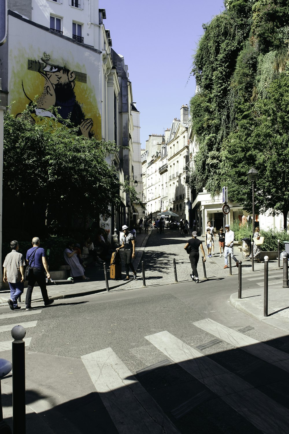 people walking on sidewalk during daytime