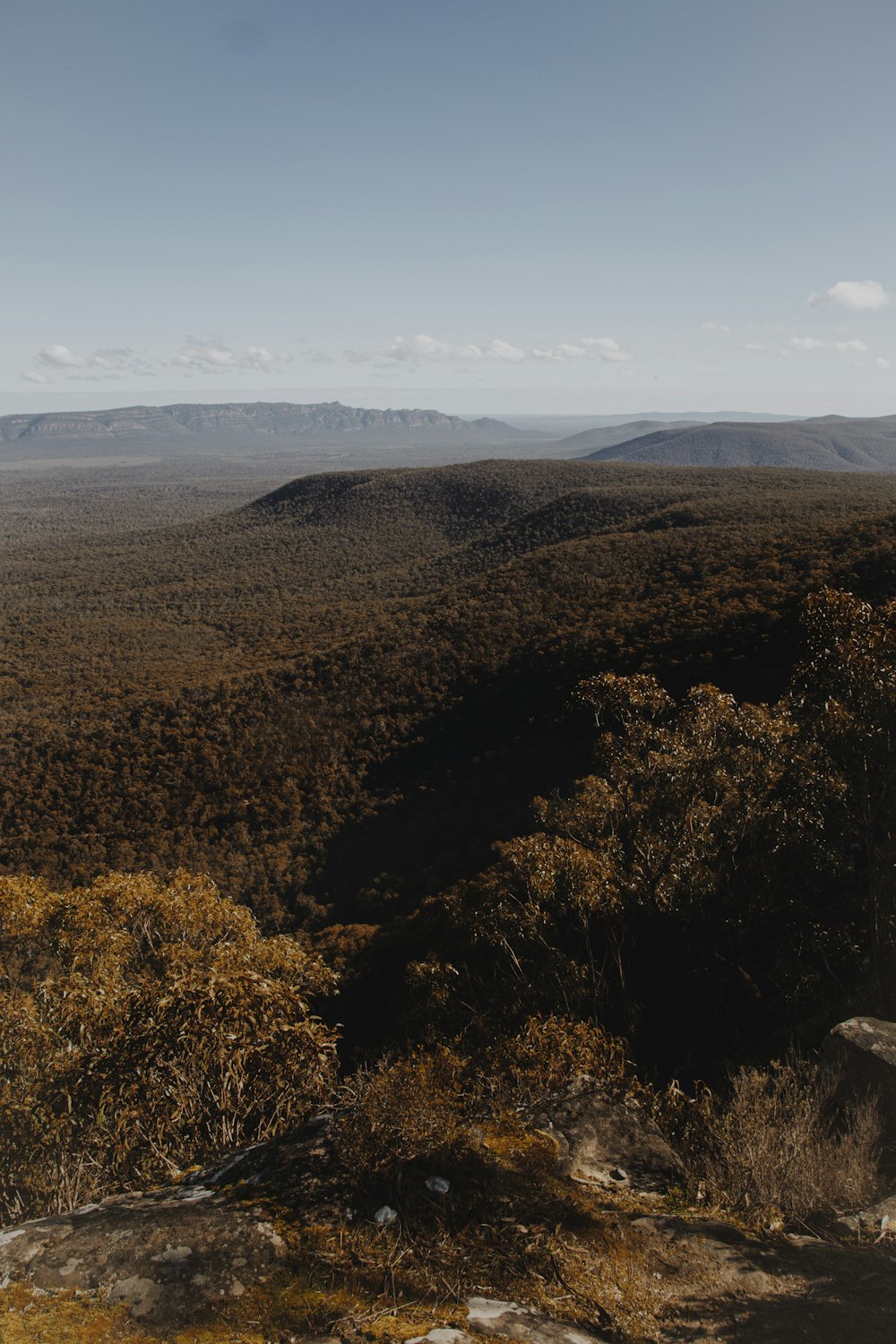 brown and green mountains under blue sky during daytime