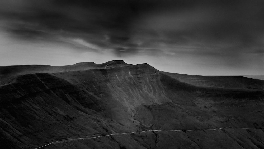 grayscale photo of rocky mountain