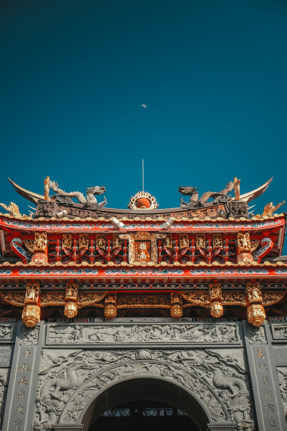 red and gray temple under blue sky during daytime