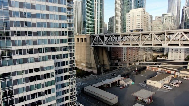 A collage showing real estate buildings, farming fields, and cargo trucks symbolizing diverse services.