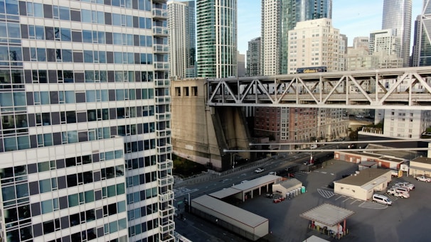 A dynamic collage showing infrastructure projects, heavy machinery, and electronic components symbolizing global trade.