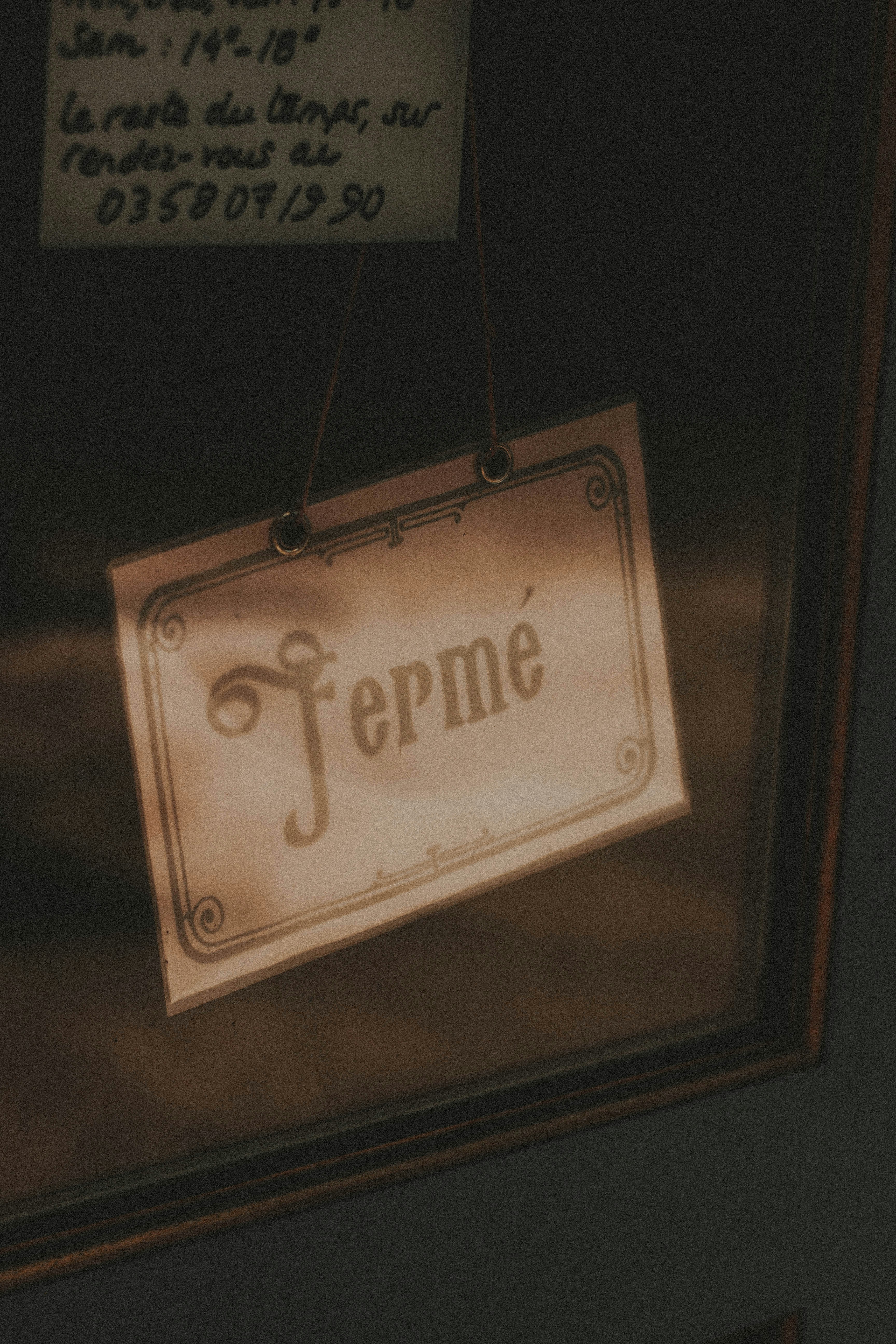 a sign hanging from the side of a door