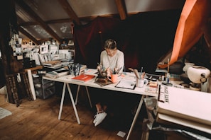 A quiet corner filled with personal notes and creative materials scattered around.