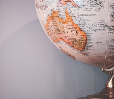 white and brown desk globe