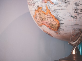 white and brown desk globe