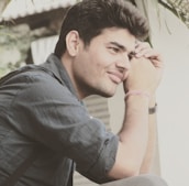 A relaxed person sitting comfortably, reflecting growth and self-paced progress.