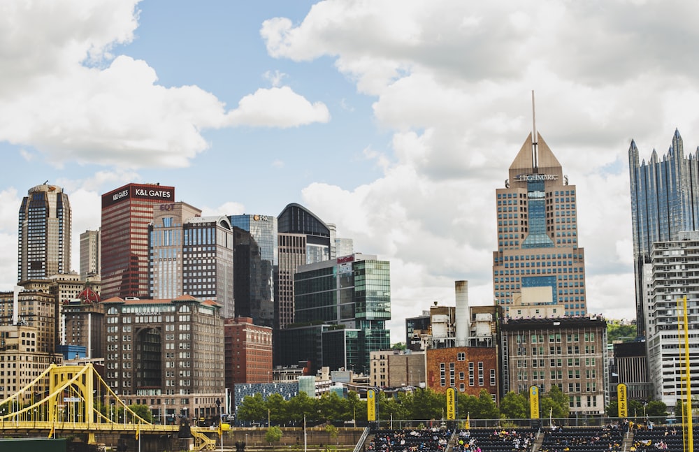 city buildings under white clouds during daytime