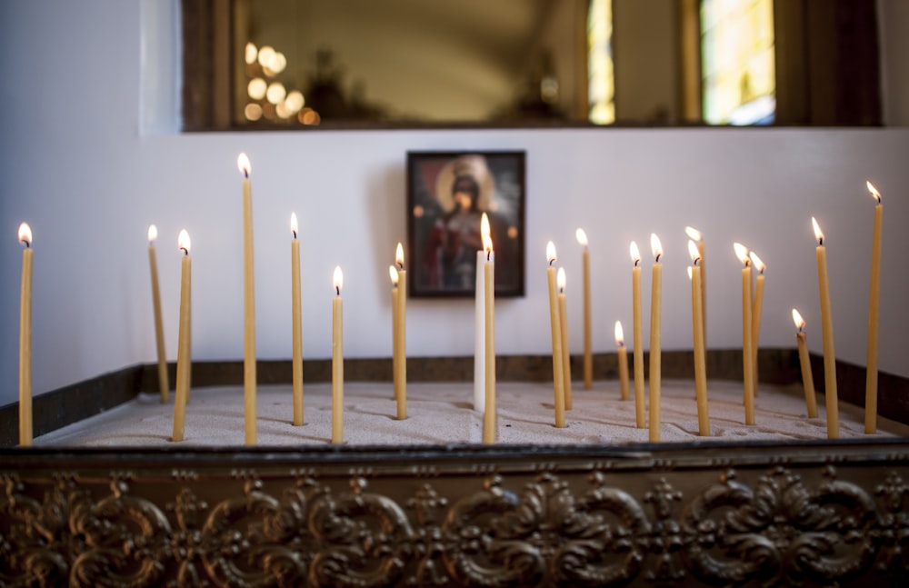 white candles on brown wooden table