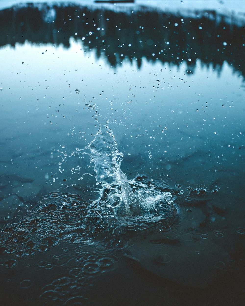 water splash on body of water during daytime