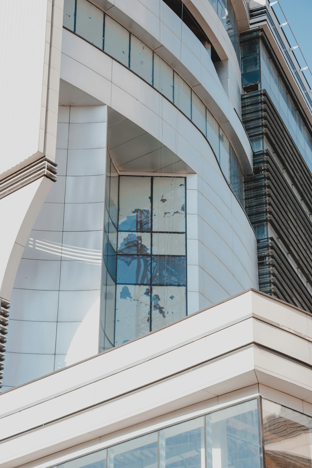 white concrete building with glass windows