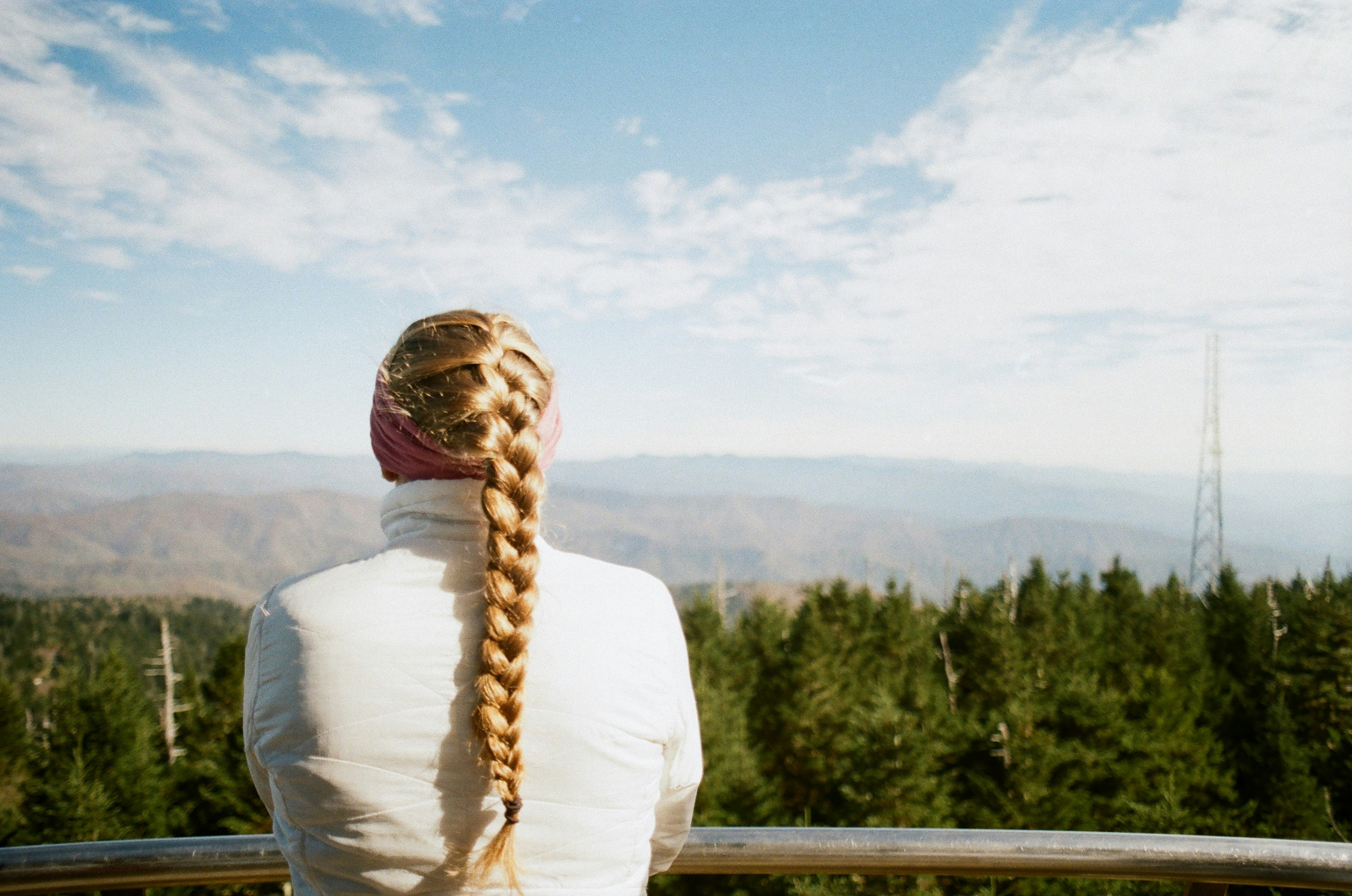 a woman over 50 with a french braid on long hair
