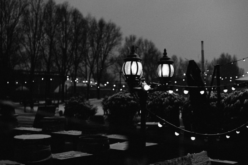 grayscale photo of people walking on bridge