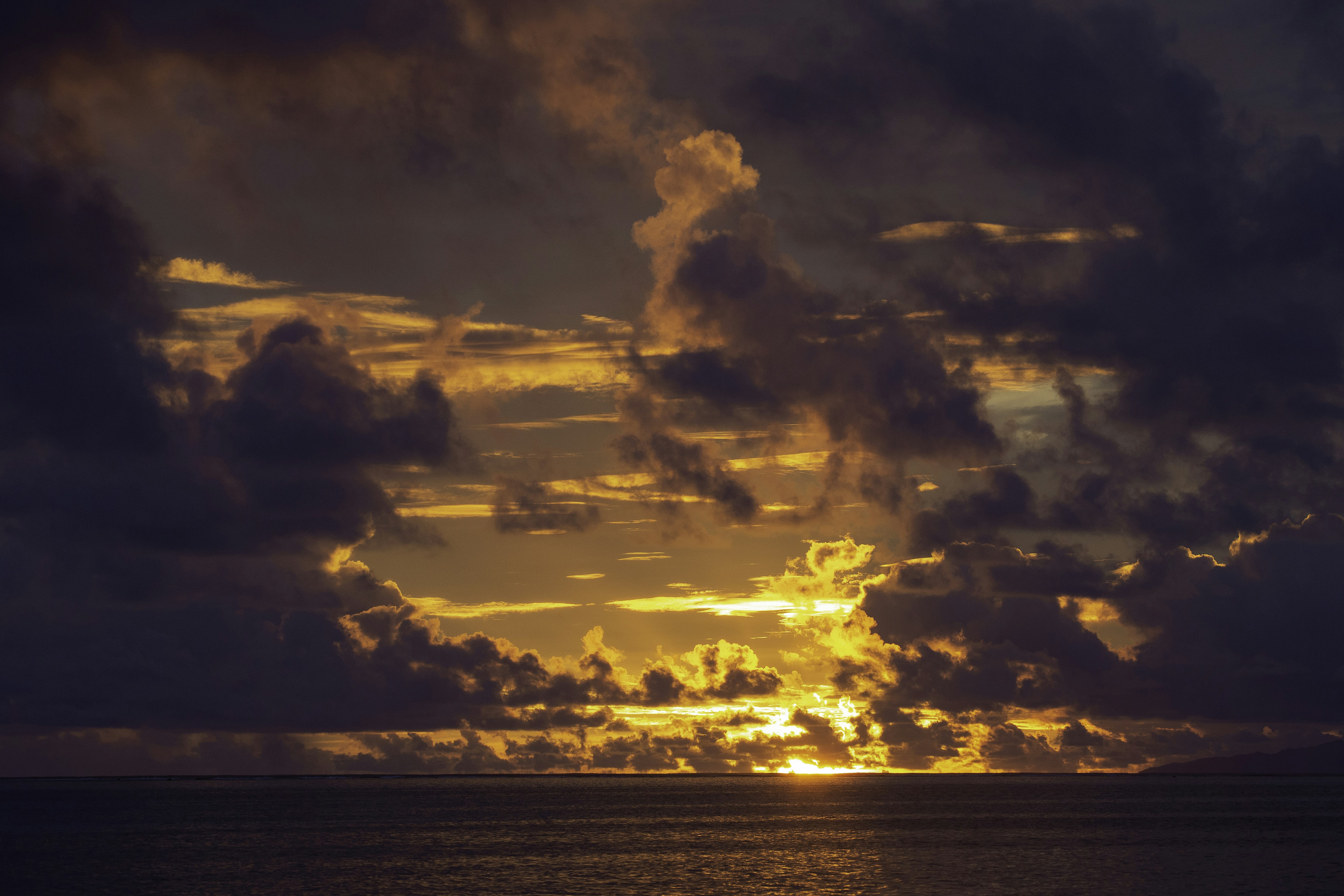 body of water under cloudy sky during sunset, Sunset Huahine