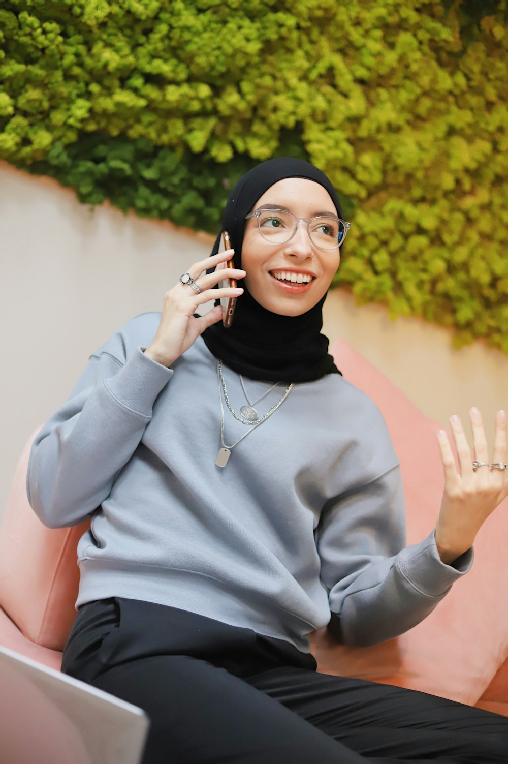 woman in gray sweater and black hijab