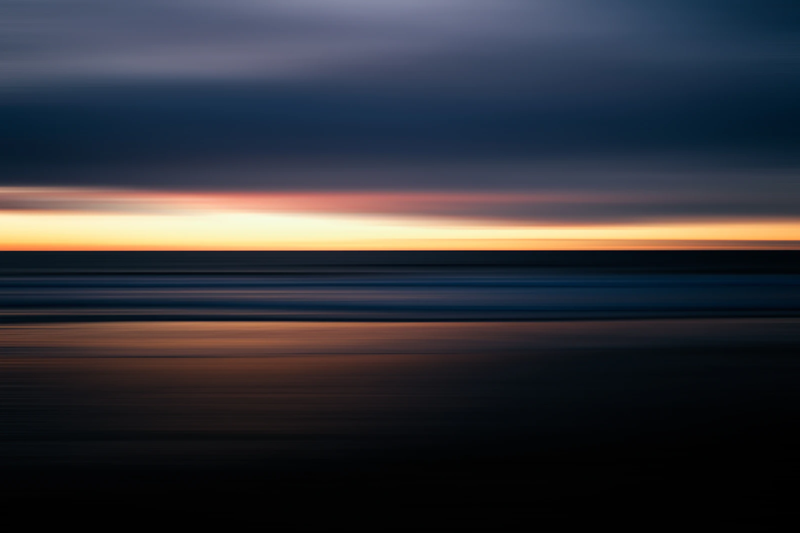 Jersey beach and sunset for a Channel Islands holiday - Photo from Unsplash
