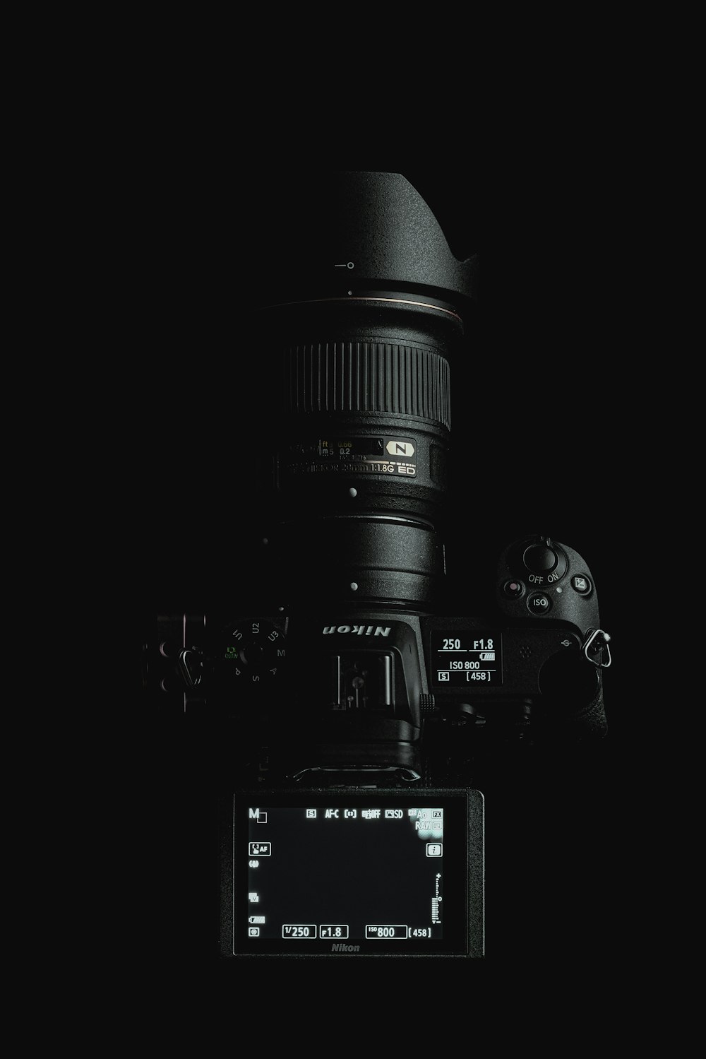 black dslr camera on black surface