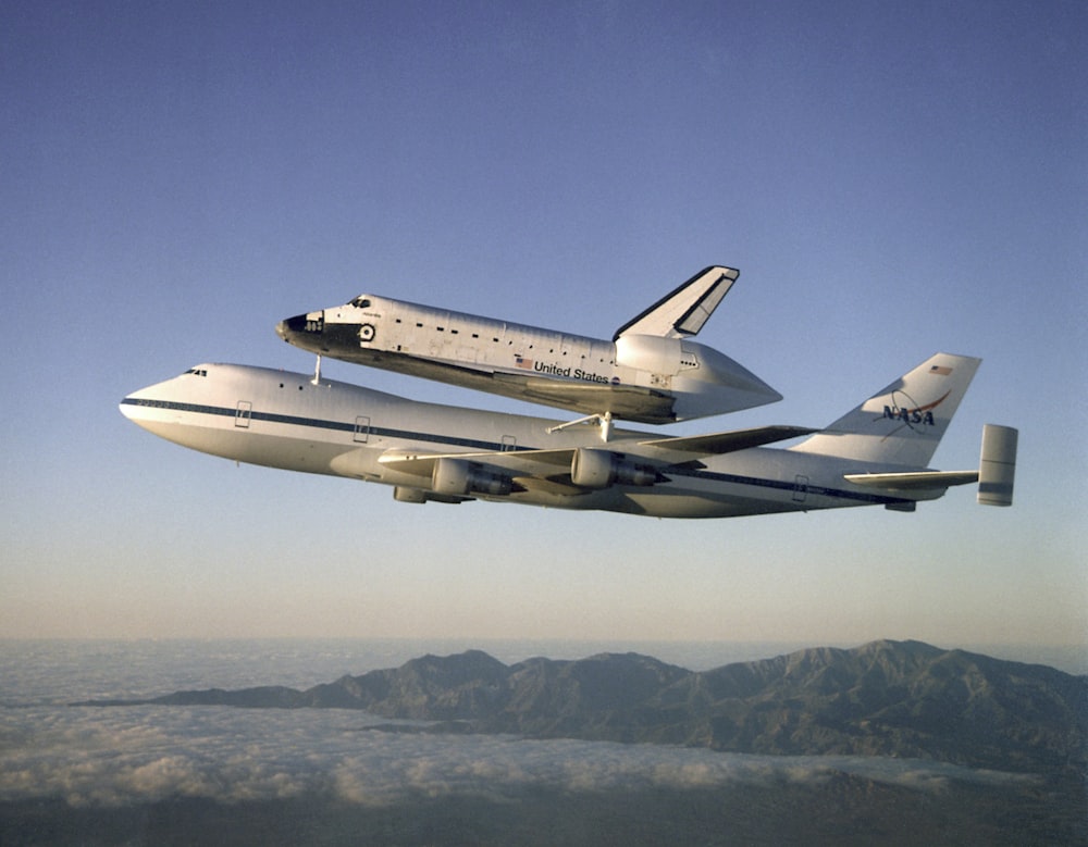 Airplane carries space shuttle in flight