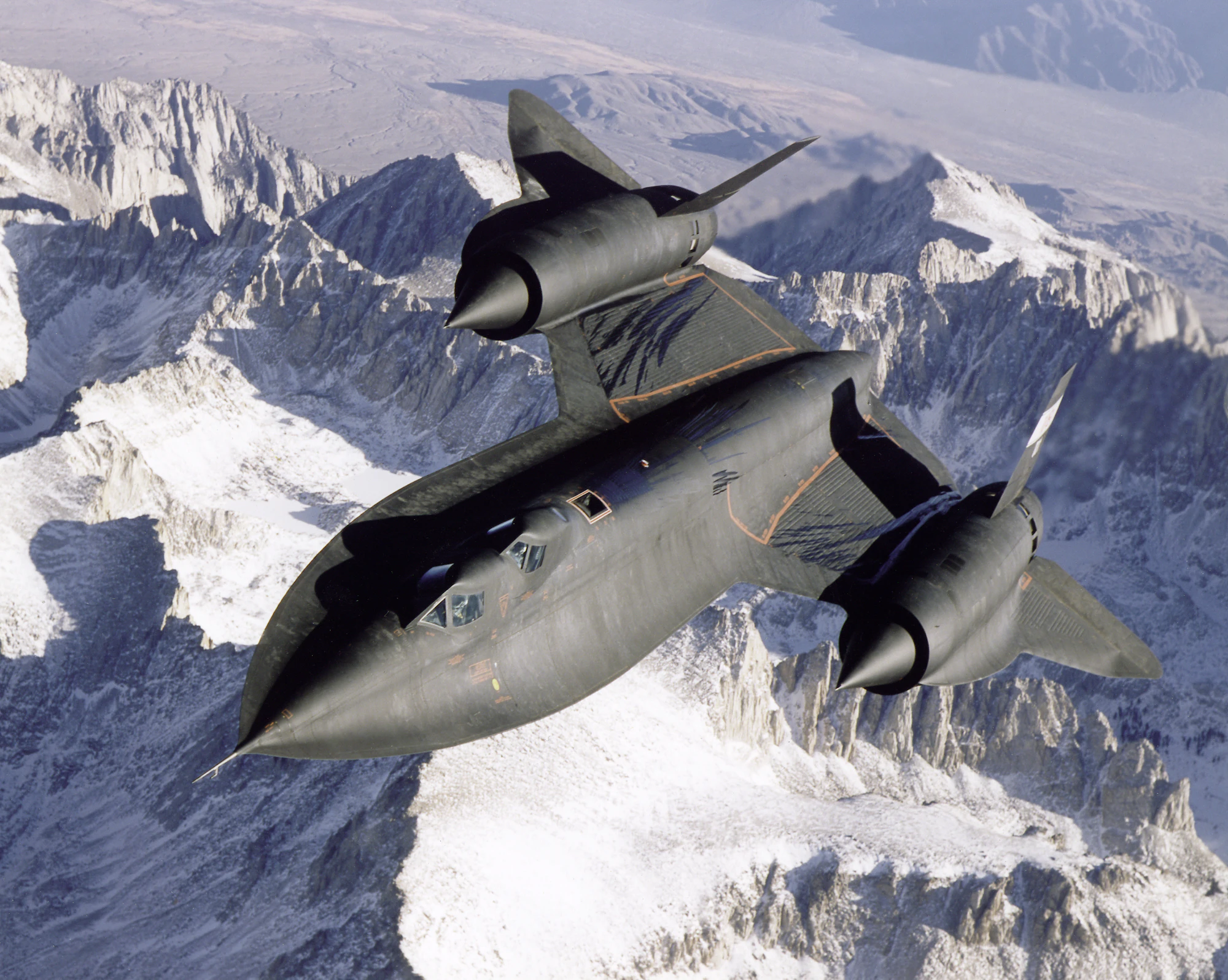 Reconnaissance aircraft over mountainous terrain
