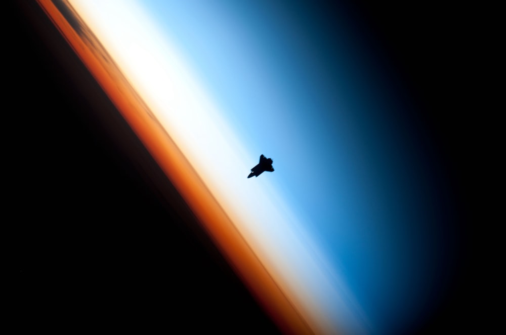 Space Shuttle orbits above earth atmosphere