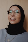 woman in black hijab wearing eyeglasses