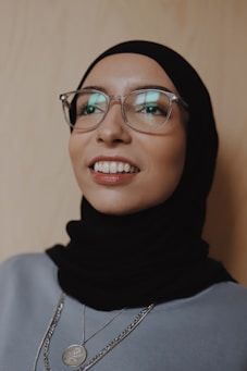 woman in black hijab wearing eyeglasses