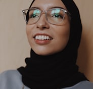 woman in black hijab wearing eyeglasses
