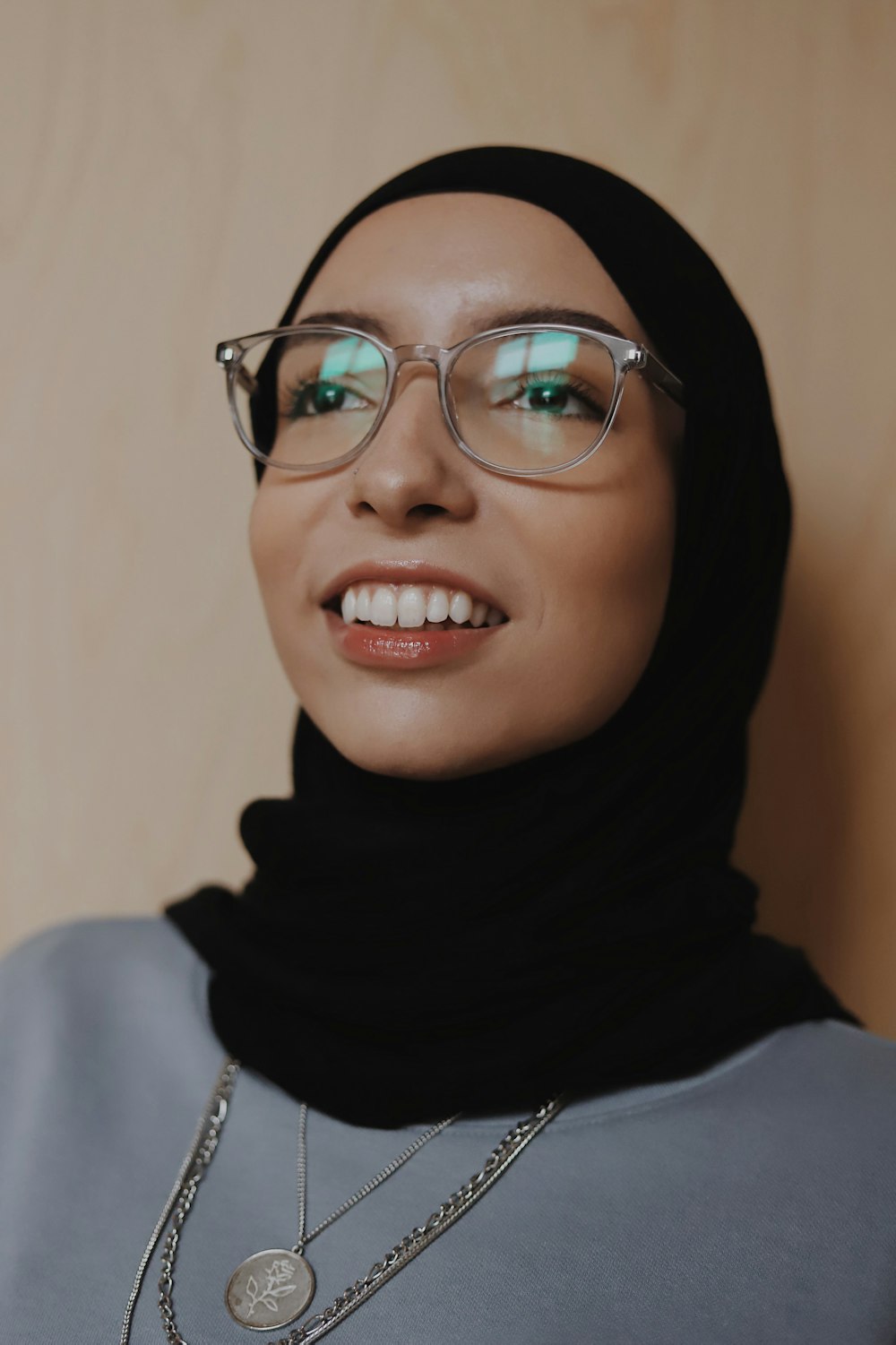 woman in black hijab wearing eyeglasses