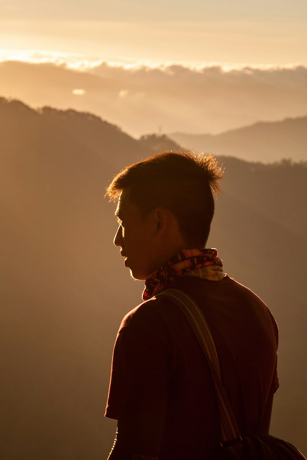 man in black jacket looking at the sky during daytime