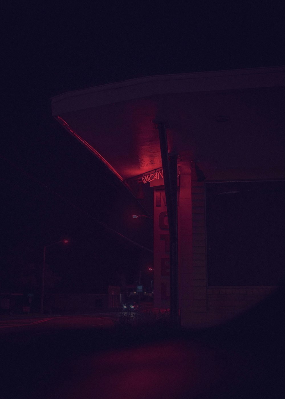 white and red building during night time