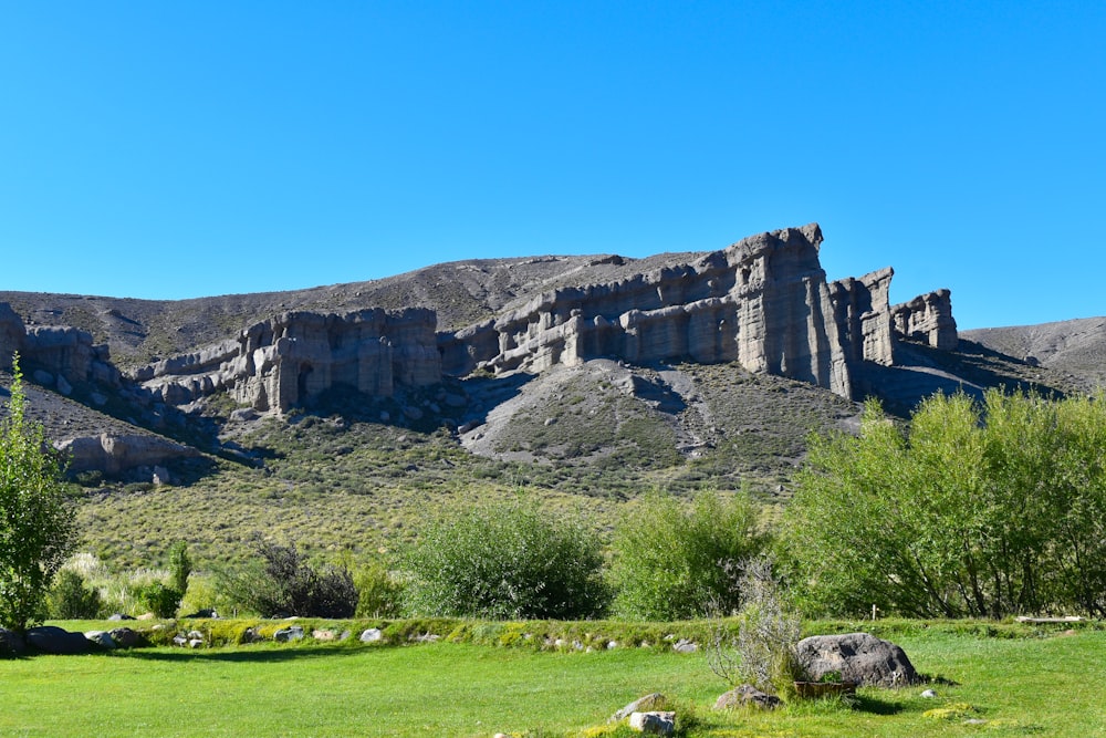 brown rock formation under blue sky during daytime