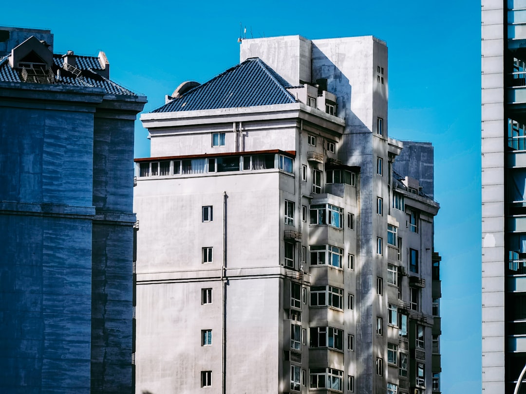 white concrete building under blue sky during daytime