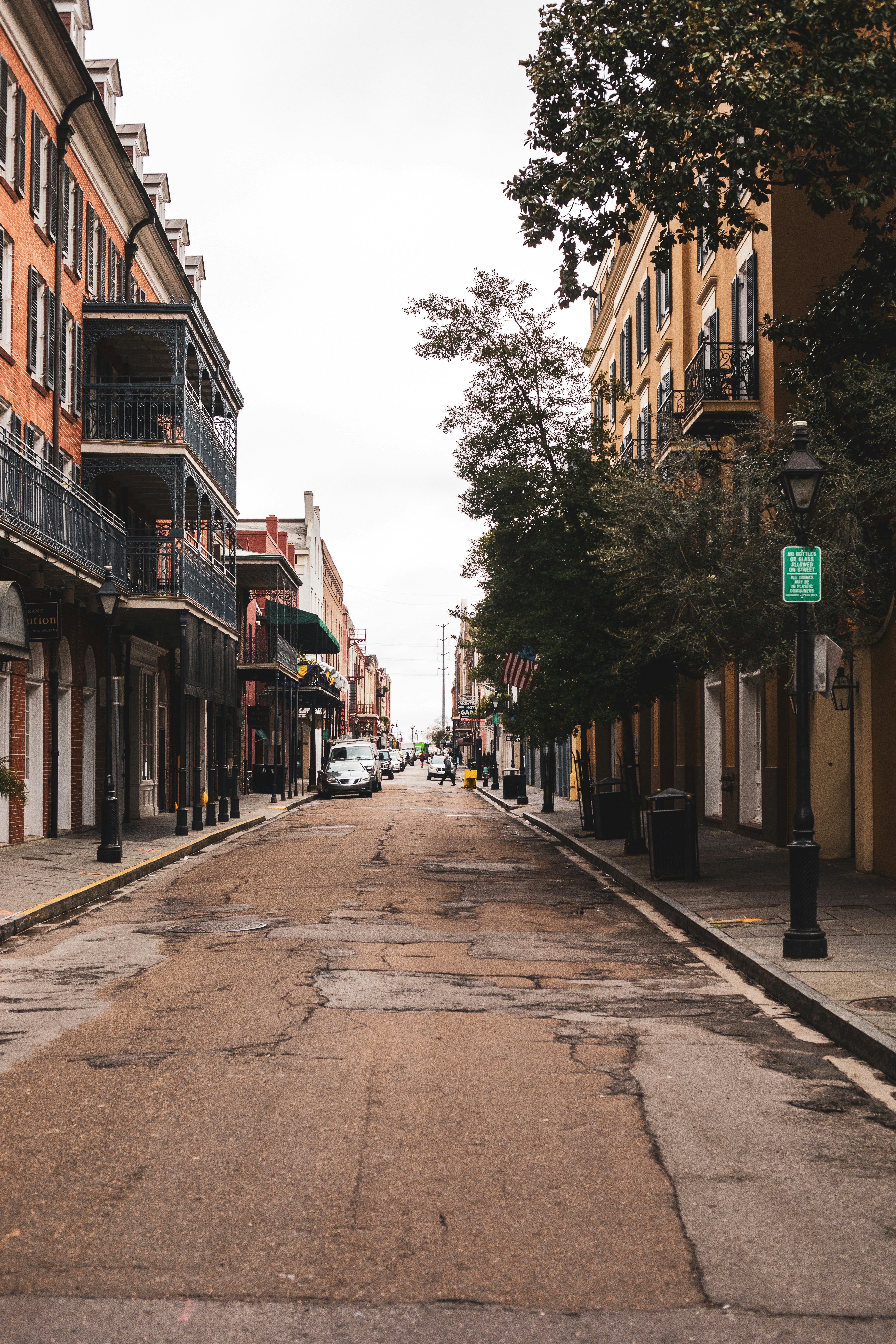 people walking on sidewalk between buildings during daytime